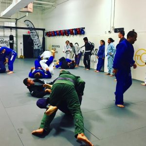 Students at PBJJ engage in the Pass Protect Sweep exercise