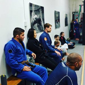 Emily and students watch the mat